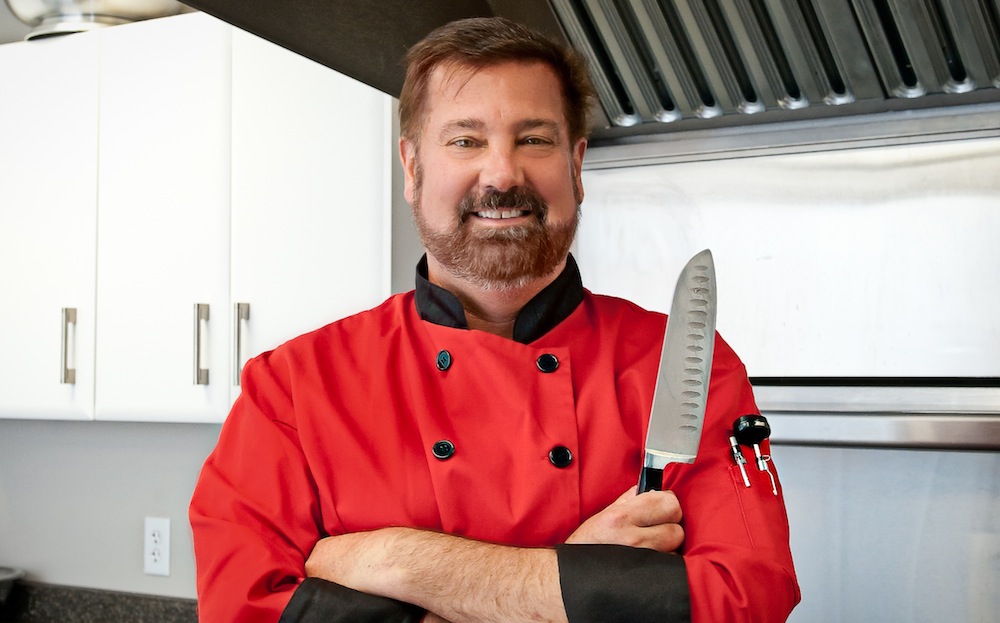 Chef holding a kitchen knife.